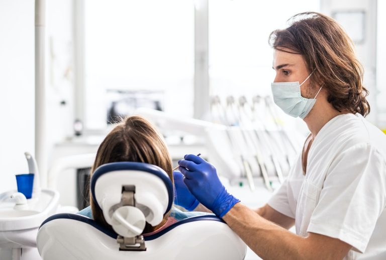 A dental check-up of patient in dentist surgery